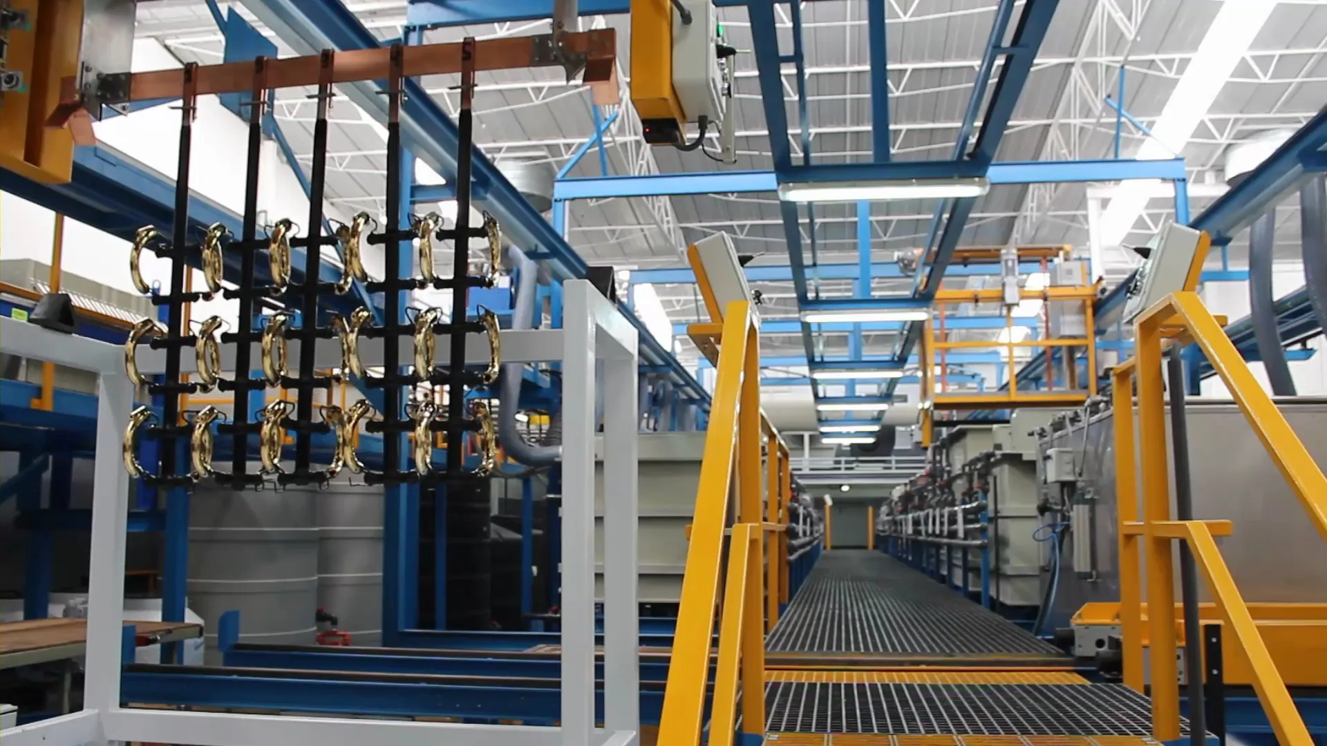 Chrome-plated brass spouts on a plating rack