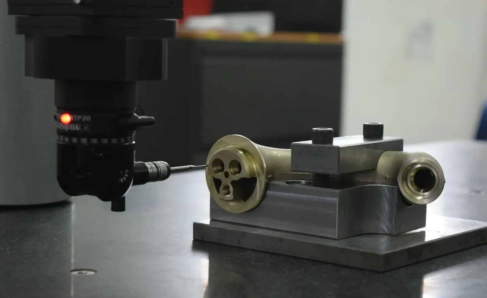 Brass valve component under CMM inspection